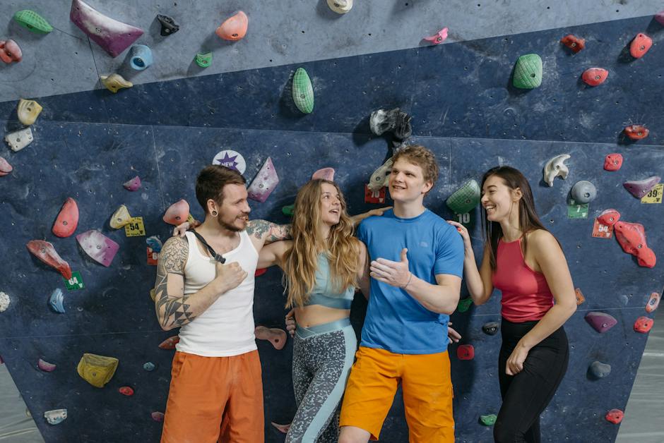 Image: A group of climbers scaling a high wall in a climbing centre