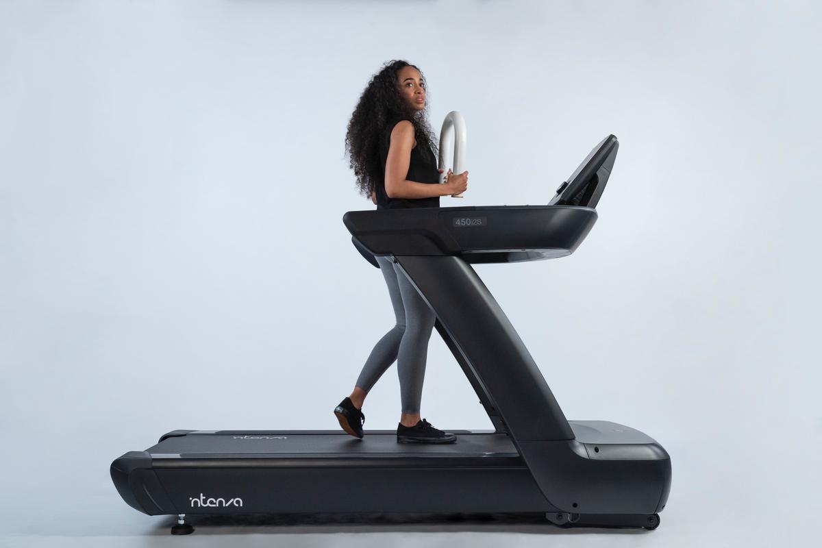 image of a fitness influencer walking on a treadmill